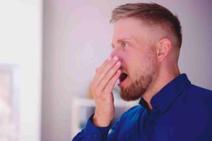 Bad Smell Dental Breath And Hand Near Mouth